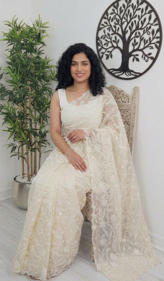 Beautiful embroidered and scalloped  organza saree