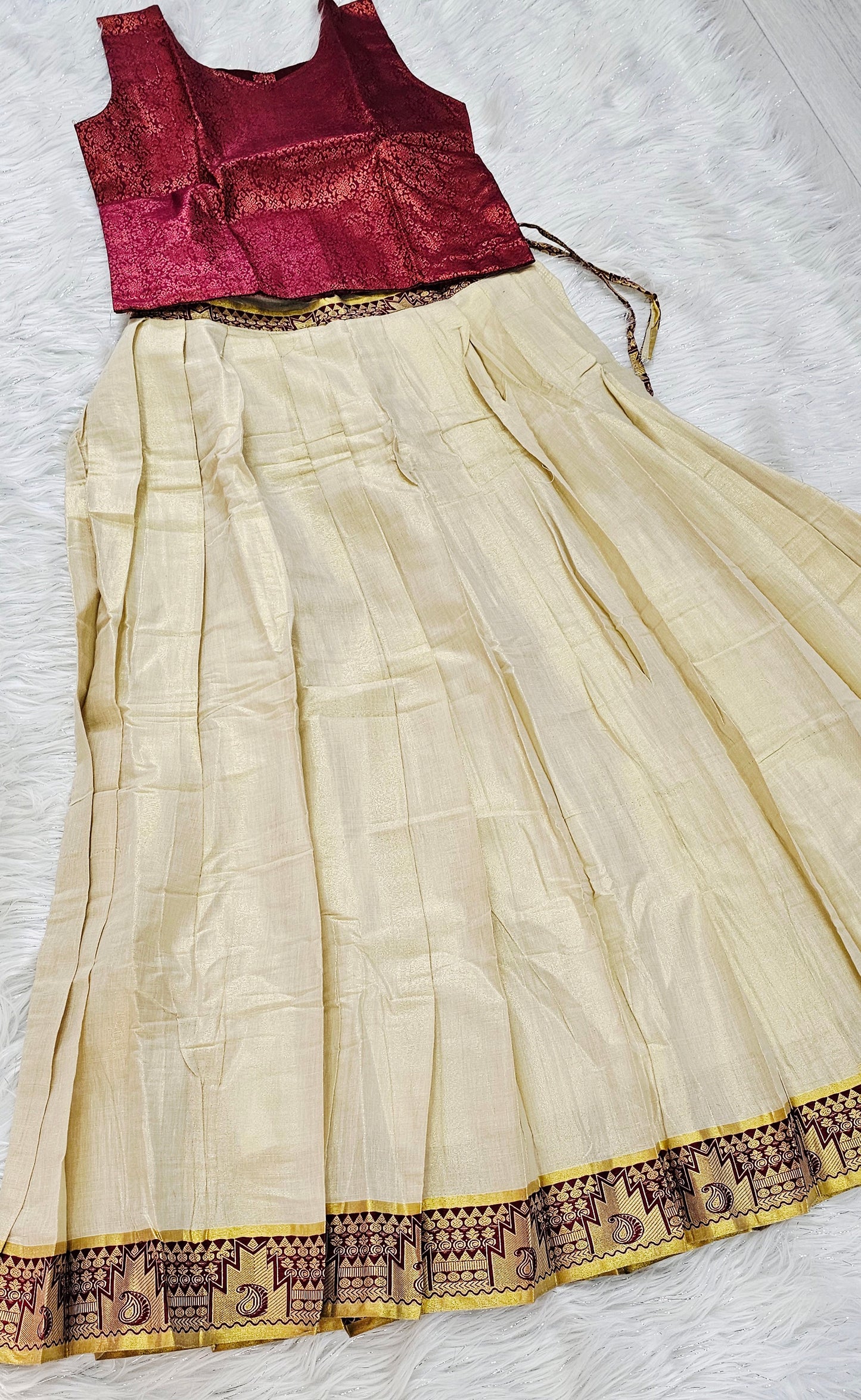 Soft silk dhavani paired with a ready-to-wear maroon blouse