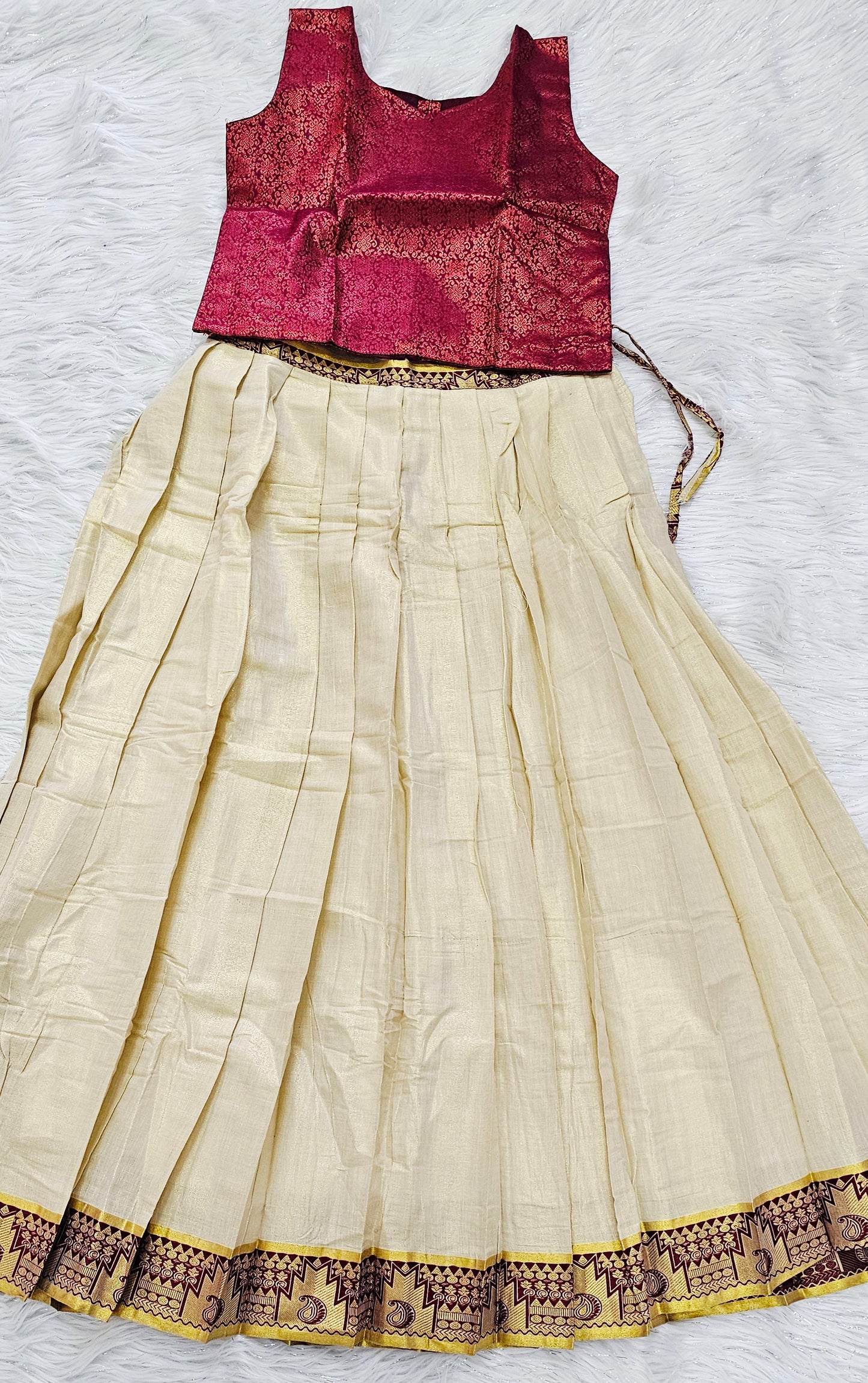 Soft silk dhavani paired with a ready-to-wear maroon blouse