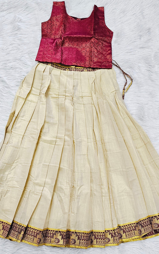 Soft silk dhavani paired with a ready-to-wear maroon blouse