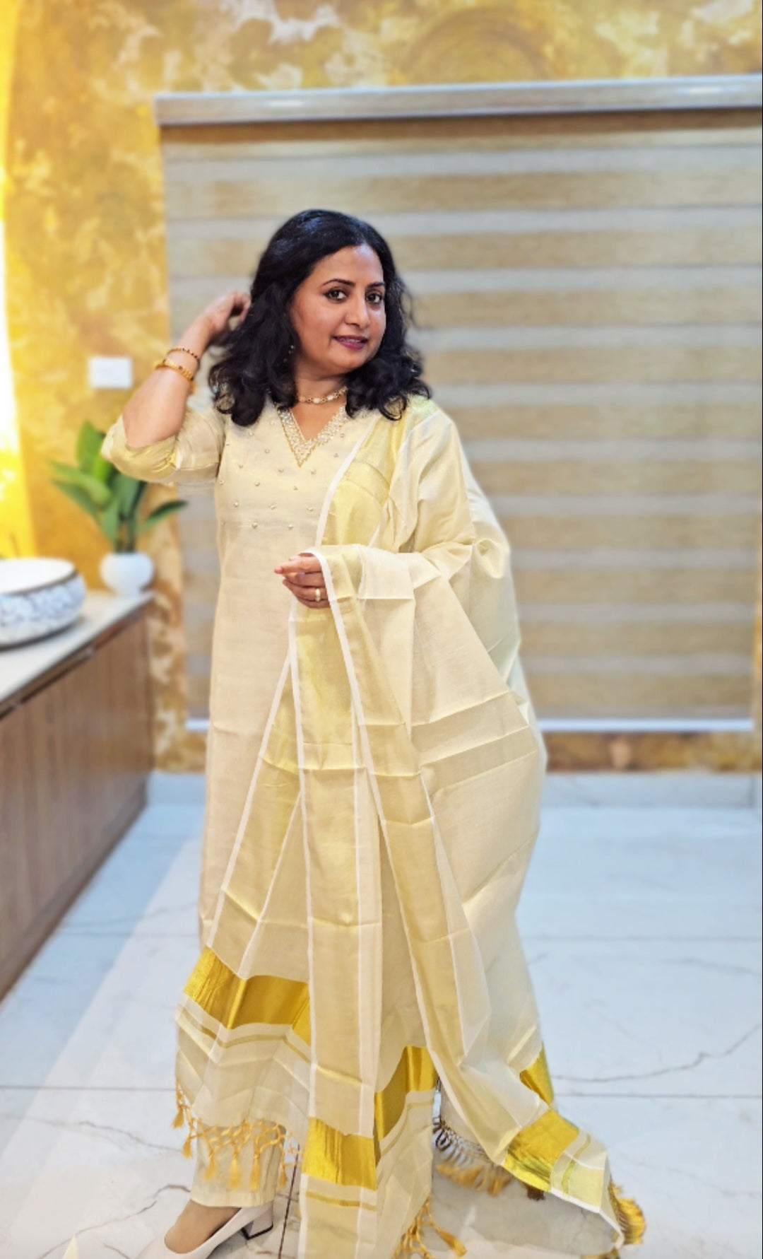 Beautiful hand worked Onam tissue three piece suit