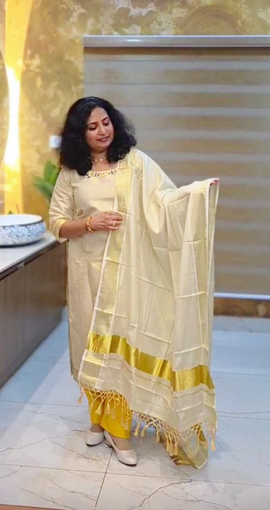 Beautiful embroidered Onam tissue three piece salwar suit