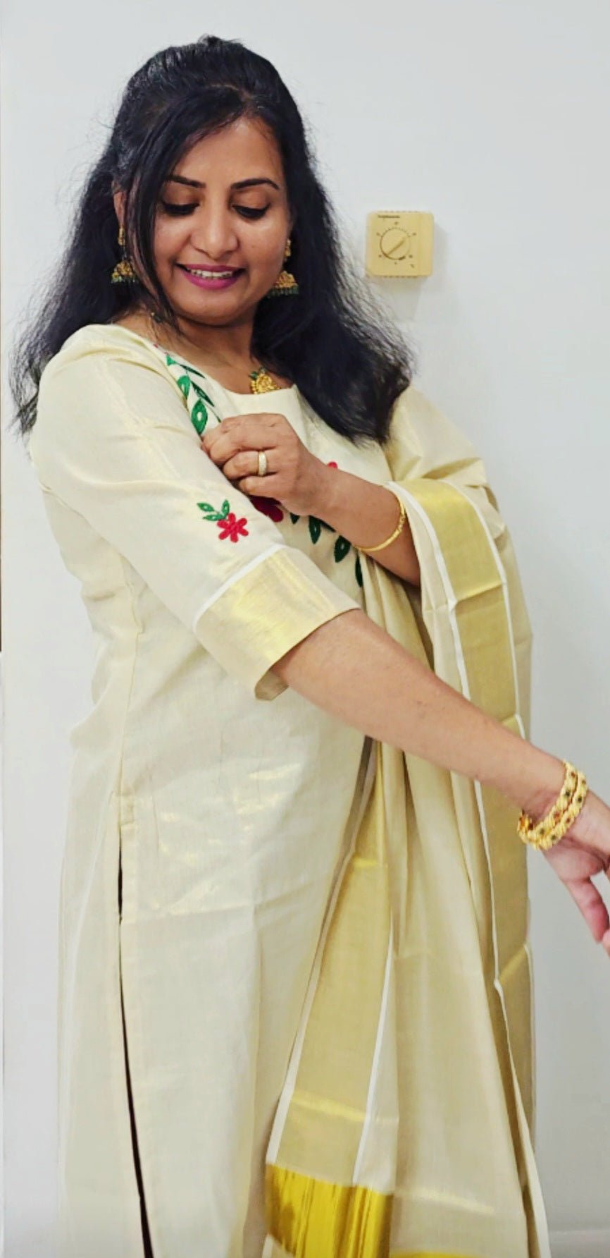 Beautiful embroidered Tissue Onam three piece suit